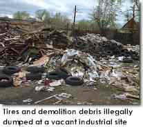 Tires and demolition debris illegally dumped
