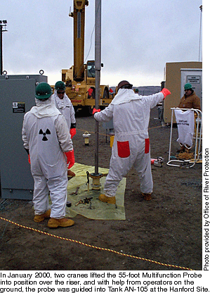 In January 2000, two cranes lifted the 55-foot Multifunction Probe into position over the rear, and with help from operators on the ground, the probe was guided into Tank AN-105 at the Hanford Site.