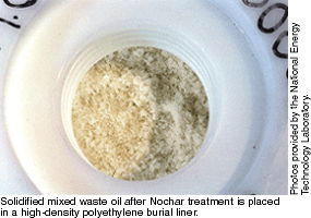 Solidified mixed waste oil after Nochar treatment is placed in a high-density polyethylene burial liner.