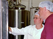 MnTAP staff and intern in a dairy